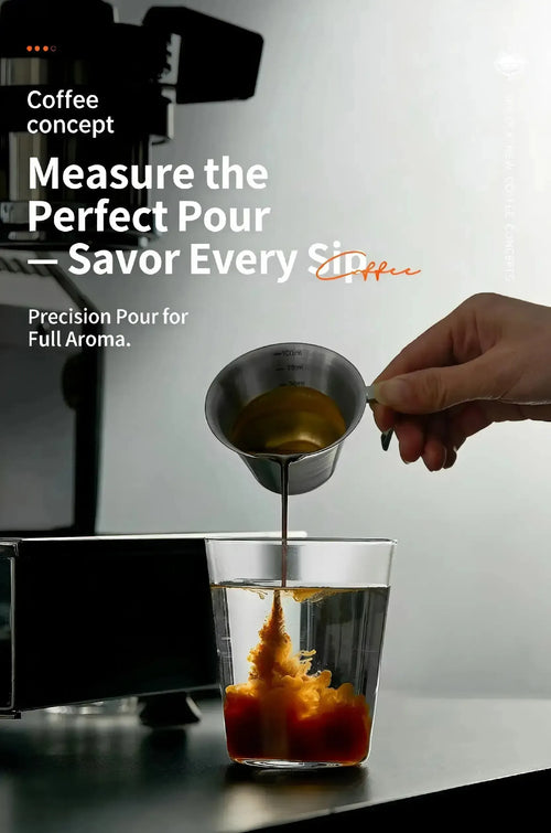 100ml stainless steel espresso measuring cup pouring coffee into a glass