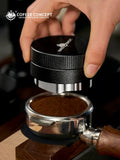 Cup of smooth, balanced test coffee in a white ceramic mug on a wooden table